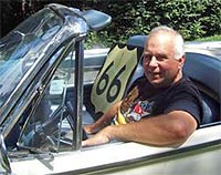 photo of steve rider sitting in a vintage convertible