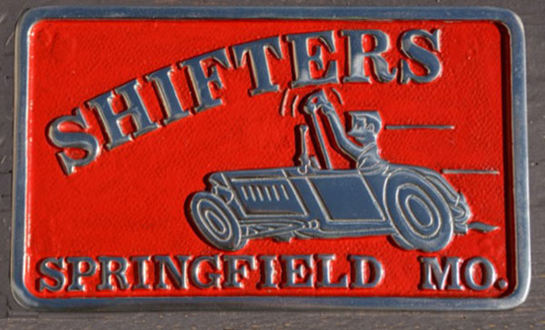 red plaque with vintage car and text reading "shifters Springfield mo"